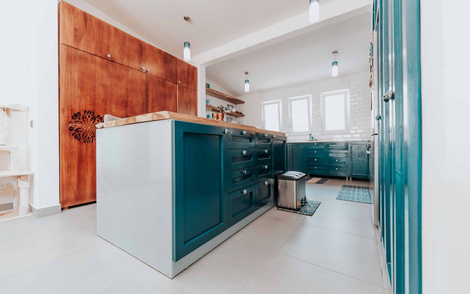 Painted in-frame kitchen cabinets and island with timber worktop